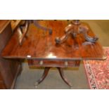 An early 19th century mahogany drop leaf table