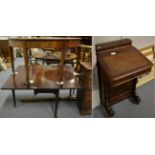 An early 19th century mahogany drop leaf gateleg table, a mahogany demi lune side table and an