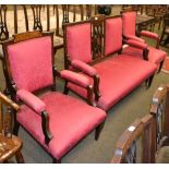 A Victorian mahogany inlaid two seater settee together with two matching armchairs