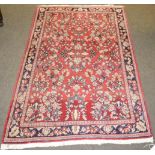 A Saroukh rug, West Iran, the strawberry field of flowering plants enclosed by narrow borders,m