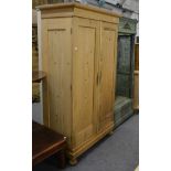 A reproduction pine wardrobe and a green painted coat stand