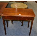 A mahogany fold over tea table and an Indian style copper topped table with folding wooden base