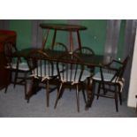 An Ercol elm refectory table, six chairs and a coffee table (8)