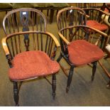 Two Windsor armchairs, the backs decorated with spindles and a central splat