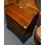 An oak bureau of small proportions