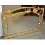 An early 19th century style gilt wood and composition over mantel mirror