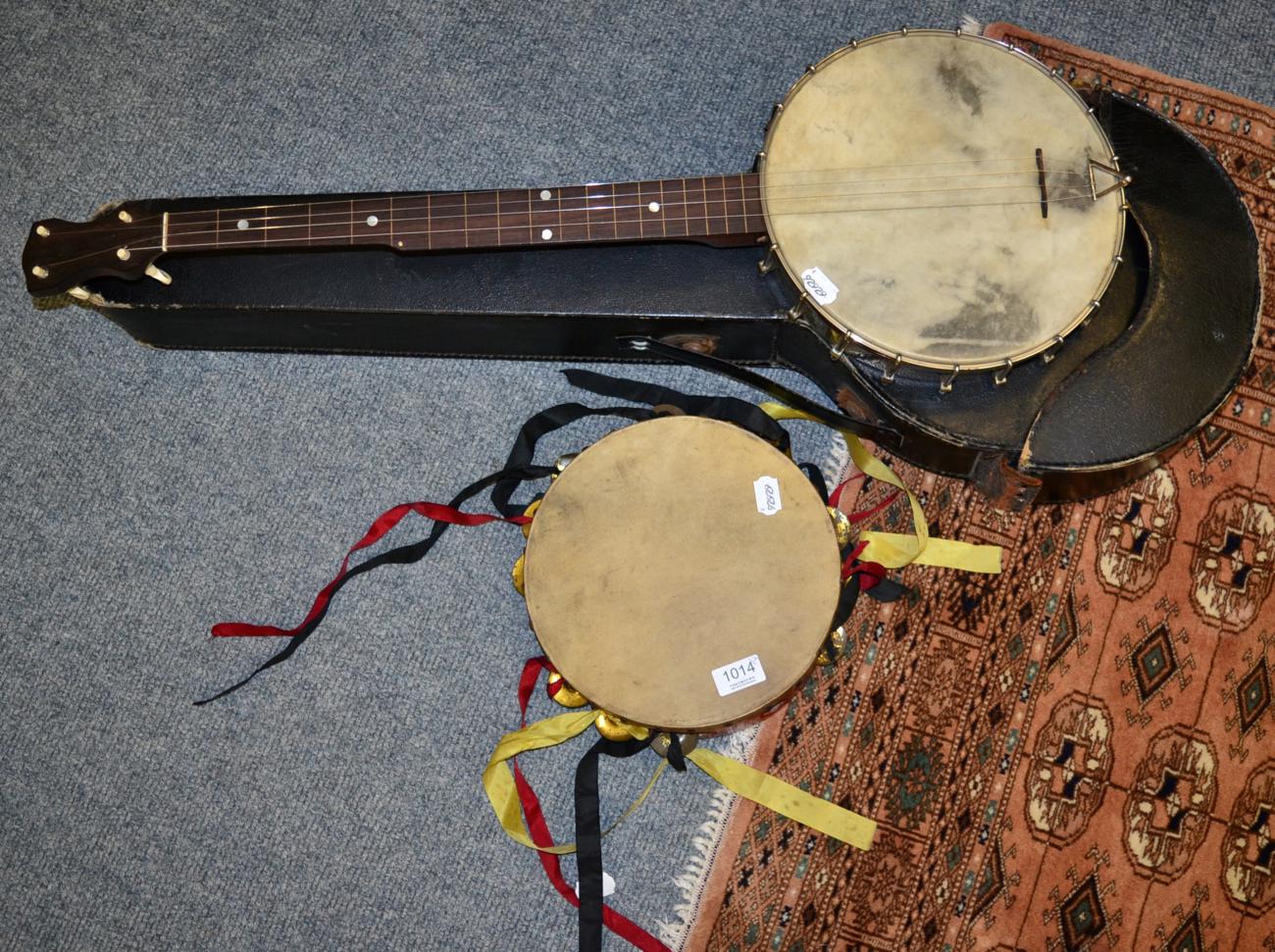 A four string banjo and a tambourine