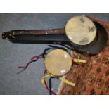 A four string banjo and a tambourine