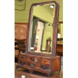 An 18th century parcel gilt walnut toilet mirror