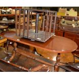 An Edwardian revolving bookcase and a clothes rack