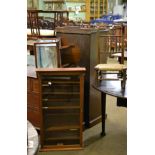 A mahogany glazed wall hanging cabinet, a mahogany wall display cabinet and a rush seated child's