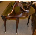 A mahogany drop leaf table raised upon pad feet, early 19th century and later