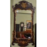 A George III parcel gilt mahogany fret work mirror