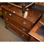 An early 19th century mahogany three height chest of drawers