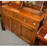 A 20th century oak side cabinet