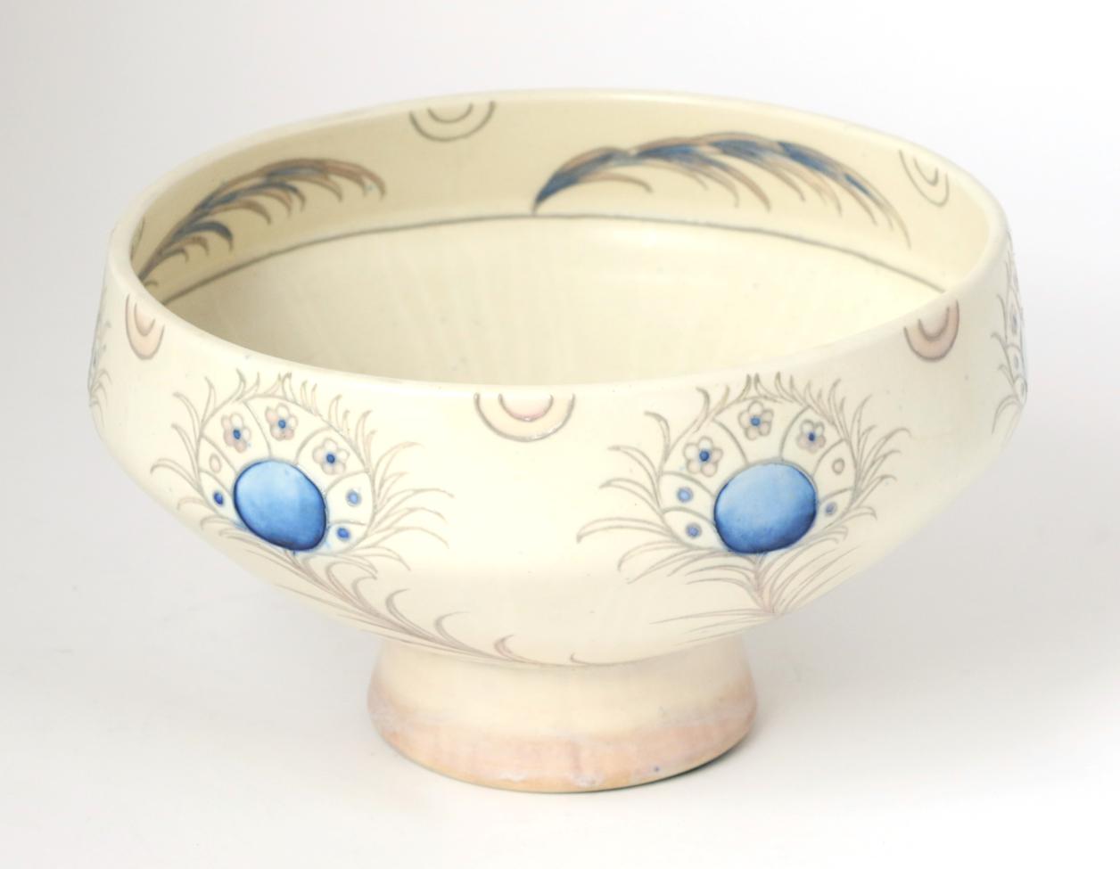 A William Moorcroft salt glazed Peacock Feathers pattern pedestal bowl, with painted and impressed