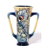 A modern Moorcroft pottery Floating Feathers pattern two handled loving cup, designed by Emma