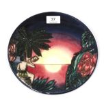 A modern Moorcroft pottery plate in the Birth of Light 2000 year plate pattern, 278/2000, with