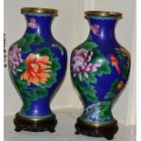 A pair of large cloisonne vases on hardwood stands