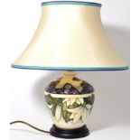 A Moorcroft table lamp in the Juneberry pattern by Anji Davenport, 20cm high (excluding fitting)