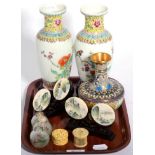 A group of Oriental items including Chinese famille rose vases, a set of four porcelain disks, two