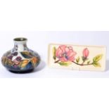 A Moorcroft Bramble pattern vase designed by Sally Tuffin, 11cm and a Magnolia pattern pen tray,