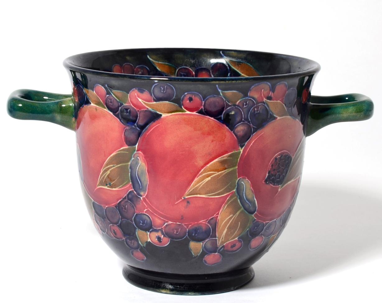 A Moorcroft pottery Pomegranate pattern twin handled vase, with painted and impressed marks, 13.