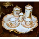 A French Limoges porcelain tete a tete service with tray, circa 1900