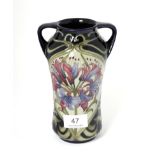 A modern Moorcroft pottery Sweet Amaryllis pattern twin handled vase by Kerry Goodwin, with