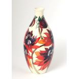 A modern Moorcroft pottery TRIAL vase in the Ruby Red pattern, dated 22.10.02 with painted and