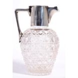 A silver mounted cut glass water jug