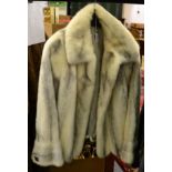 White and grey striped mink jacket with a scalloped hem