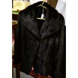 Short dark mink fur jacket, with slanting pockets to the front, single breasted