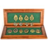 A Collection of Badges, including four brass helmet plate centres, six brass glengarry badges and