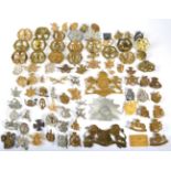 A Collection of Approx. 55 Belgian Cap Badges and Helmet Plates, mainly brass and plated examples,