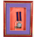 A New Zealand Medal 1864-1866, name erased and dings to edge, contained in a display frame, the