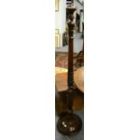 An early 20th century carved mahogany standard lamp; an Edwardian mahogany and satinwood banded