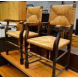 A pair of Arts & Crafts oak and rope work elbow chairs together with a mid 20th century leather