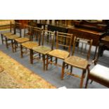 A set of four 19th century chairs with bobbin turned dress rails, a pair of similar chairs and