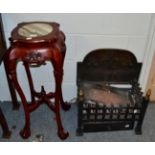 A Chinese marble inset plant stand and a cast iron fire grate with fleur-de-lis decorated back plate