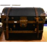 A leather bound dome top trunk