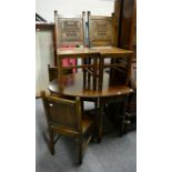 An oak gate leg table and four chairs