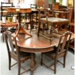An oval oak extending dining table and six chairs