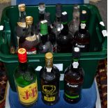 A green plastic box of Port and other spirits