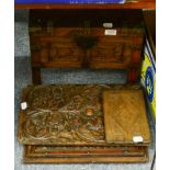 A 19th century rosewood panel depicting flowers; a 19th century rosewood chest with brass mounts;