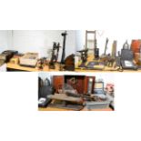 A collection of items including cobblers lasts, clock elements, drain rods, vintage radios, cast