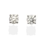 A Pair of 18 Carat White Gold Solitaire Diamond Earrings, round brilliant cut diamonds in claw