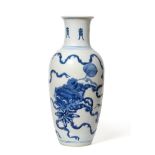 A Chinese Porcelain Baluster Vase, Kangxi, with flared neck, painted in underglaze blue with lion