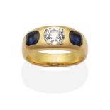 A Diamond and Sapphire Ring, an old cut diamond spaced by octagonal cut sapphires inset to a