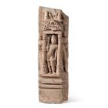 An Indian Sandstone Architectural Panel, in 10th century style, carved with a figure standing in a